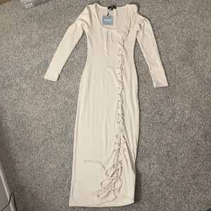 Brand new beige misguides side open dress.